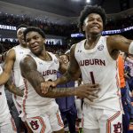 
              Auburn guard Wendell Green Jr. (1) and guard K.D. Johnson (0) celebrates after defeating Kentucky during the second half of an NCAA college basketball game Saturday, Jan. 22, 2022, in Auburn, Ala. (AP Photo/Butch Dill)
            