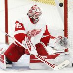 
              Detroit Red Wings goaltender Alex Nedeljkovic (39) makes a save during the third period of an NHL hockey game against the Buffalo Sabres, Monday, Jan. 17, 2022, in Buffalo, N.Y. (AP Photo/Jeffrey T. Barnes)
            