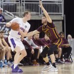 
              Evansville's Evan Kuhlman (10) is guarded by Loyola Chicago's Tate Hall (24) during an NCAA college basketball game Tuesday, Jan. 18, 2022 in Evansville, Ind. (Macabe Brown/Evansville Courier & Press via AP)
            
