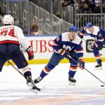 
              New York Islanders center Casey Cizikas (53) moves the puck up ice against Washington Capitals defenseman John Carlson (74) during the second period of an NHL hockey game, Saturday, Jan. 15, 2022, in Elmont, N.Y. (AP Photo/Mary Altaffer)
            