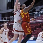 
              Stanford forward James Keefe (22) defends as Southern California guard Ethan Anderson (20) aims for the basket during the first half of an NCAA college basketball game Tuesday, Jan. 11, 2022, in Stanford, Calif. (AP Photo/Josie Lepe)
            