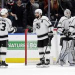 
              Los Angeles Kings defenseman Drew Doughty (8) celebrates with Dustin Brown (23) after defeating the New York Islanders in an NHL hockey game Thursday, Jan. 27, 2022, in Elmont, N.Y. (AP Photo/Adam Hunger)
            