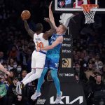
              New York Knicks forward Julius Randle (30) shoots against Charlotte Hornets center Mason Plumlee (24) during the first half of an NBA basketball game, Monday, Jan. 17, 2022, in New York. (AP Photo/John Minchillo)
            
