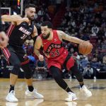 
              Toronto Raptors guard Fred VanVleet (23) drives to the basket as Miami Heat guard Max Strus (31) defends during the first half of an NBA basketball game, Saturday, Jan. 29, 2022, in Miami. (AP Photo/Lynne Sladky)
            