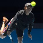 
              Japan's Naomi Osaka hits a return during practice on Rod Laver Area ahead of the Australian Open tennis championships in Sunday, Jan. 16, 2022, in Melbourne, Australia. (AP Photo/Simon Baker)
            