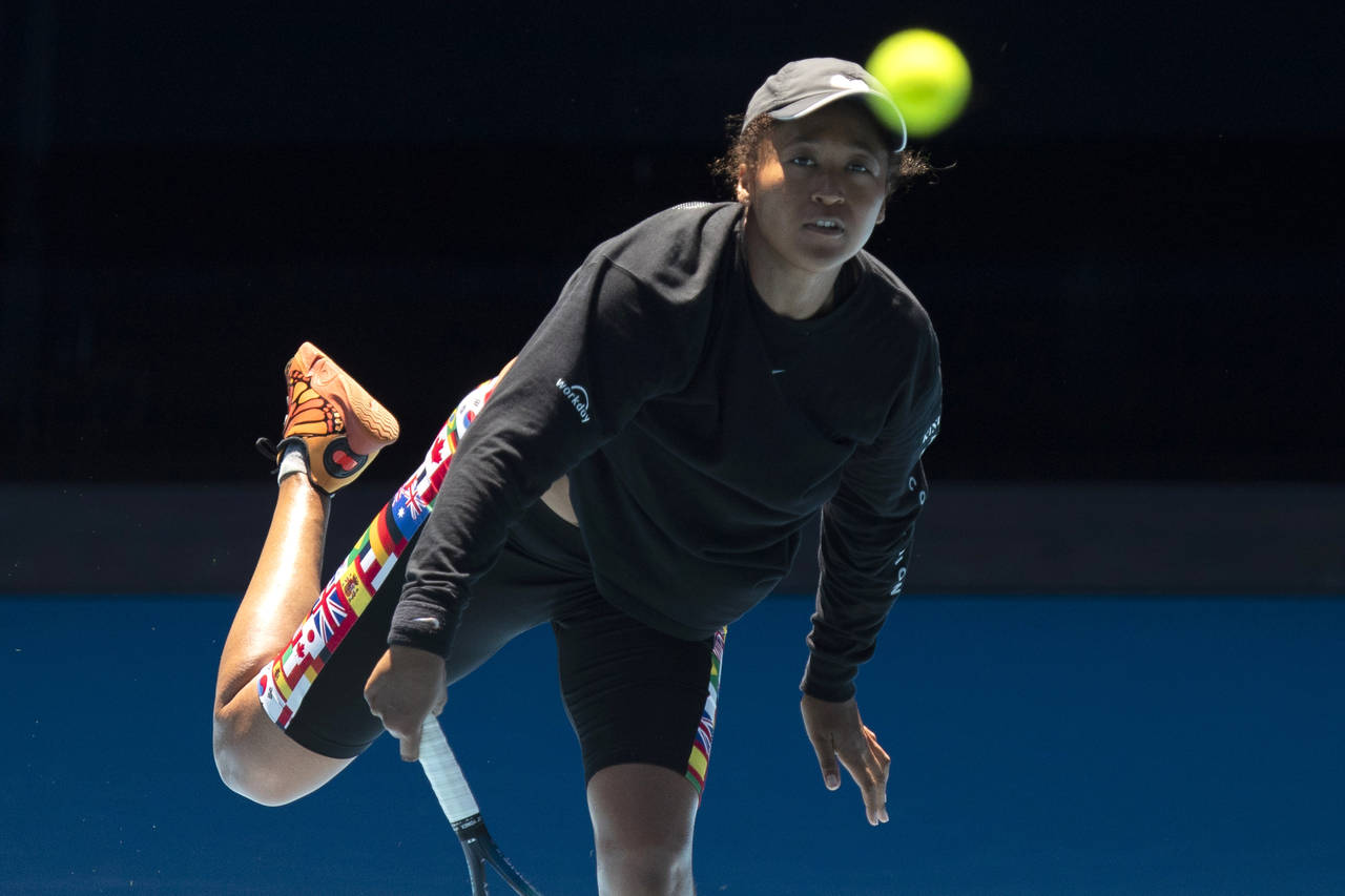 Japan's Naomi Osaka hits a return during practice on Rod Laver Area ahead of the Australian Open te...