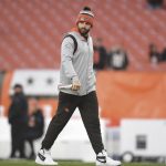 
              Cleveland Browns quarterback Baker Mayfield walks on the field before an NFL football game between the Cleveland Browns and the Cincinnati Bengals, Sunday, Jan. 9, 2022, in Cleveland. (AP Photo/Nick Cammett)
            