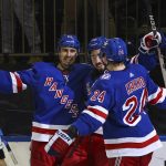 
              New York Rangers center Mika Zibanejad (93) is congratulated by teammates Chris Kreider (20) and Kaapo Kakko (24) after scoring his third goal against the Tampa Bay Lightning, during the second period of an NHL hockey game, Sunday, Jan 2, 2022, at Madison Square Garden in New York. (AP Photo/Rich Schultz)
            