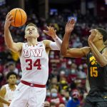 
              Wisconsin's Brad Davison (34) shoots against Iowa's Keegan Murray (15) during the second half of an NCAA college basketball game Thursday, Jan. 6, 2022, in Madison, Wis. (AP Photo/Andy Manis)
            