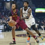 
              Cleveland Cavaliers' Darius Garland, left, drives against Brooklyn Nets' Kyrie Irving (11) in the first half of an NBA basketball game, Monday, Jan. 17, 2022, in Cleveland. (AP Photo/Tony Dejak)
            