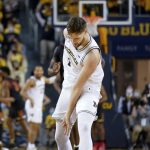 
              Michigan center Hunter Dickinson (1) celebrates his three-point basket against Maryland in the first half of an NCAA college basketball game in Ann Arbor, Mich., Tuesday, Jan. 18, 2022. (AP Photo/Paul Sancya)
            