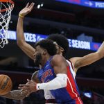 
              Detroit Pistons forward Saddiq Bey, foreground, goes to the basket against Cleveland Cavaliers center Jarrett Allen during the first half of an NBA basketball game Sunday, Jan. 30, 2022, in Detroit. (AP Photo/Duane Burleson)
            