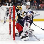 
              Columbus Blue Jackets goalie Joonas Korpisalo, right, makes a stop in front of Pittsburgh Penguins forward Danton Heinen during the first period of an NHL hockey game in Columbus, Ohio, Friday, Jan. 21, 2022. (AP Photo/Paul Vernon)
            