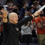 
              Louisville head coach Chris Mack reacts to a call during the first half of an NCAA college basketball game against Virginia, Monday Jan. 24, 2022, in Charlottesville, Va. (AP Photo/Steve Helber)
            