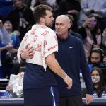 
              Dallas Mavericks guard Luka Doncic, left, and Indiana Pacers head coach Rick Carlisle greet each other after their NBA basketball game in Dallas, Saturday, Jan. 29, 2022. (AP Photo/Tony Gutierrez)
            