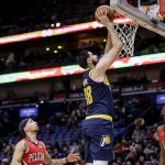 
              Indiana Pacers center Goga Bitadze (88) shoots over New Orleans Pelicans guard Jose Alvarado (15) and forward Herbert Jones (5) in the second quarter of an NBA basketball game in New Orleans, Monday, Jan. 24, 2022. (AP Photo/Derick Hingle)
            