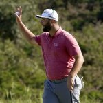 
              Jon Rahm, of Spain, waves after finishing the final round of the Tournament of Champions golf event, Sunday, Jan. 9, 2022, at Kapalua Plantation Course in Kapalua, Hawaii. (AP Photo/Matt York)
            