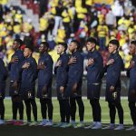 
              FILE - Ecuador players sing their national anthem prior to a FIFA World Cup Qatar 2022 qualifying soccer match at Rodrigo Paz Delgado stadium in Quito, Ecuador, Nov. 11, 2021.  Ecuador summoned 28 players on Saturday, Jan. 22, 2022, for the crucial double round of qualifiers in which they will host Brazil, and visit Peru. (Jose Jacome/AP File)
            