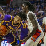 
              LSU forward Alex Fudge (3) drives for the basket against Florida guard Phlandrous Fleming Jr., right, during the first half of an NCAA college basketball game Wednesday, Jan. 12, 2022, in Gainesville, Fla. (AP Photo/Alan Youngblood)
            