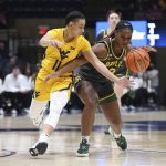 
              Baylor guard Jordan Lewis (3) is defended by West Virginia guard Ja'Naiya Quinerly (11) during the first half of an NCAA college basketball game in Morgantown, W.Va., Saturday, Jan. 29, 2022. (AP Photo/Kathleen Batten)
            