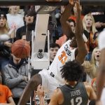 
              Oklahoma State forward Moussa Cisse (33) dunks in front of Iowa State forward Robert Jones (12) in the first half of an NCAA college basketball game Wednesday, Jan. 26, 2022, in Stillwater, Okla. (AP Photo/Sue Ogrocki)
            