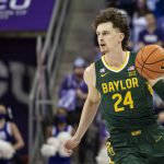 
              Baylor guard Matthew Mayer (24) controls the ball in the first half of an NCAA college basketball game against TCU in Fort Worth, Texas, Saturday, Jan. 8, 2022. (AP Photo/Emil Lippe)
            