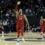 
              Texas Tech forward Marcus Santos-Silva waves to the crowd after defeating No. 1 Baylor in an NCAA college basketball game Tuesday, Jan. 11, 2022, in Waco, Texas. (AP Photo/Jerry Larson)
            
