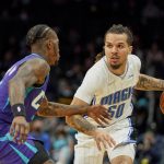 
              Orlando Magic guard Cole Anthony (50) drives around Charlotte Hornets guard Terry Rozier (3) during the first half of an NBA basketball game on Friday, Jan. 14, 2022, in Charlotte, N.C. (AP Photo/Rusty Jones)
            