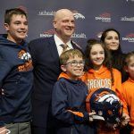 
              New Broncos head coach Nathaniel Hackett, second from left in back, poses for a photograph with his family after a news conference to introduce him as the team's new NFL head football coach Friday, Jan. 28, 2022, in Englewood, Colo. Hackett's children are, Harrison, 13, back left, London, 11, front left, Briar, 12, front center, and Everly, 9. His wife, Megan, is back right. (AP Photo/David Zalubowski)
            
