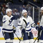 
              Tampa Bay Lightning left wing Ondrej Palat (18), right wing Nikita Kucherov (86) and defenseman Victor Hedman (77) celebrate after a goal by Kucherov during the second period of an NHL hockey game against the Buffalo Sabres on Tuesday, Jan. 11, 2022, in Buffalo, N.Y. (AP Photo/Joshua Bessex)
            