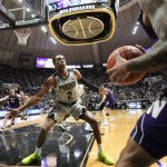 
              Purdue guard Eric Hunter Jr. (2) defends against an inbound pass by Northwestern guard Boo Buie (0) in the first half of an NCAA college basketball game in West Lafayette, Ind., Sunday, Jan. 23, 2022. (AP Photo/AJ Mast)
            