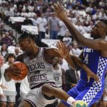 
              Kentucky forward Oscar Tshiebwe (34) fouls Texas A&M guard Quenton Jackson during the first half of an NCAA college basketball game Wednesday, Jan. 19, 2022, in College Station, Texas. (AP Photo/Justin Rex)
            