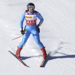 
              Italy's Sofia Goggia leaves an alpine ski, women's World Cup super-G race in Cortina d'Ampezzo, Italy, Sunday, Jan. 23, 2022. (AP Photo/Alessandro Trovati)
            