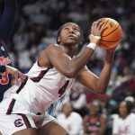 
              South Carolina forward Aliyah Boston (4) shoots against Mississippi guard Donnetta Johnson (3) during the first half of an NCAA college basketball game Thursday, Jan. 27, 2022, in Columbia, S.C. (AP Photo/Sean Rayford)
            