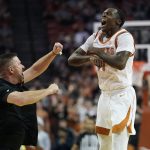 
              Texas head coach Chris Beard, left, celebrates with guard Andrew Jones (1) during the second half of an NCAA college basketball game against Oklahoma, Tuesday, Jan. 11, 2022, in Austin, Texas. (AP Photo/Eric Gay)
            