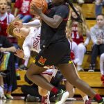
              Maryland guard Ashley Owusu (15) collides with Indiana guard Nicole Cardano-Hillary (4) en route to the basket during the second half of an NCAA college basketball game, Sunday, Jan. 2, 2022, in Bloomington, Ind. (AP Photo/Doug McSchooler)
            