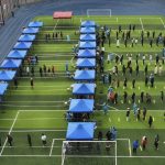 
              In this photo released by Xinhua News Agency, residents line up on a football field for the coronavirus test during a mass testing in north China's Tianjin municipality, Sunday, Jan. 9, 2022. Tianjin, a major Chinese city near Beijing has placed its 14 million residents on partial lockdown after 41 children and adults tested positive for COVID-19, including at least two with the omicron variant. (Sun Fanyue/Xinhua via AP)
            