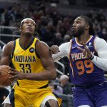 
              Indiana Pacers' Myles Turner (33) looks to shoot against Phoenix Suns' Jae Crowder (99) during the first half of an NBA basketball game, Friday, Jan. 14, 2022, in Indianapolis. (AP Photo/Darron Cummings)
            