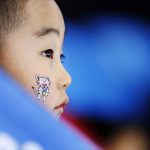 
              yes  A child wears one of the Olympic mascots on his face when watching the women's 1,500-meter speedskating race at the Gangneung Oval at the 2018 Winter Olympics in Gangneung, South Korea, Feb. 12, 2018. (AP Photo/John Locher)
            