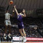 
              Purdue forward Trevion Williams (50) shoots over Northwestern center Ryan Young (15) in the second half of an NCAA college basketball game in West Lafayette, Ind., Sunday, Jan. 23, 2022. Purdue won 80-60. (AP Photo/AJ Mast)
            