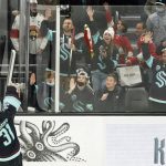 
              Seattle Kraken goaltender Philipp Grubauer (31) throws a stuffed salmon to fans after an NHL hockey game against the Florida Panthers, Sunday, Jan. 23, 2022, in Seattle. The Kraken won 5-3. (AP Photo/Ted S. Warren)
            