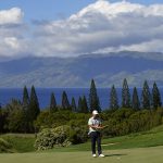 
              K.H. Lee, of South Korea, lines up his putt after missing birdie on the ninth green during the second round of the Tournament of Champions golf event, Friday, Jan. 7, 2022, at Kapalua Plantation Course in Kapalua, Hawaii. (AP Photo/Matt York)
            