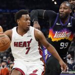 
              Miami Heat's Kyle Lowry (7) keeps the ball away from Phoenix Suns' Jae Crowder (99) during the first half of an NBA basketball game Saturday, Jan. 8, 2022, in Phoenix. (AP Photo/Darryl Webb)
            