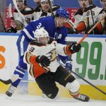 
              Toronto Maple Leafs' Auston Matthews (34) checks Anaheim Ducks' Jakob Silfverberg (33) during the first period of an NHL hockey game in Toronto on Wednesday, Jan 26, 2022. (Frank Gunn/The Canadian Press via AP)
            