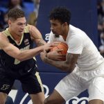 
              Purdue's Mason Gillis, left, and Penn State's Greg Lee fight for possession of the ball during an NCAA college basketball game Saturday, Jan. 8, 2022, in State College, Pa. (AP Photo/Gary M. Baranec)
            