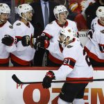 
              Ottawa Senators' Nick Paul, center, celebrates his goal with teammates during the first period of an NHL hockey game against the Calgary Flames in Calgary, Alberta, Thursday, Jan. 13, 2022. (Jeff McIntosh/The Canadian Press via AP)
            