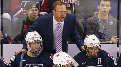 FILE - U.S.head coach Joel Johnson reacts during the third period of a women's hockey game against ...
