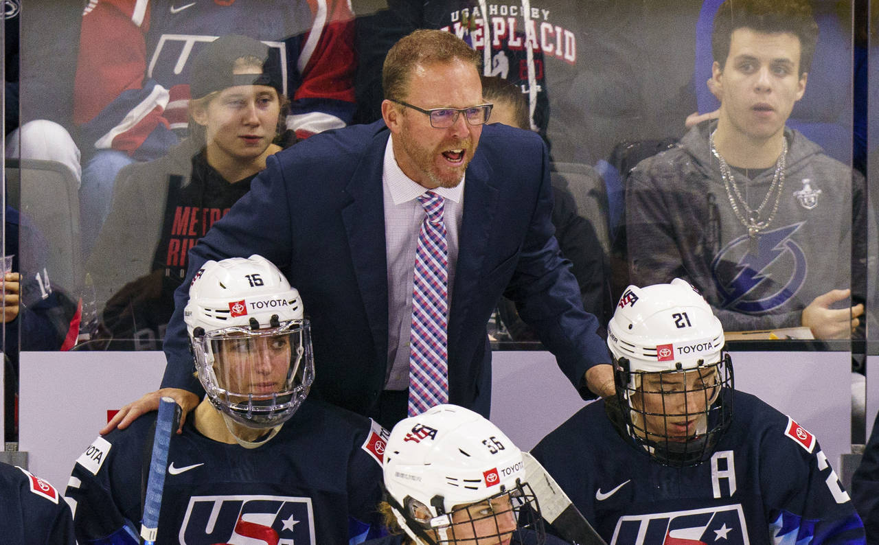 FILE - U.S.head coach Joel Johnson reacts during the third period of a women's hockey game against ...