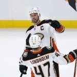
              Anaheim Ducks center Ryan Getzlaf, top, is congratulated by defenseman Hampus Lindholm (47) after his goal against the Boston Bruins during the first period of an NHL hockey game, Monday, Jan. 24, 2022, in Boston. (AP Photo/Charles Krupa)
            