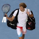 
              Alexander Zverev of Germany walks from Margaret Court Arena following his fourth round loss to Denis Shapovalov of Canada at the Australian Open tennis championships in Melbourne, Australia, Sunday, Jan. 23, 2022. (AP Photo/Hamish Blair)
            